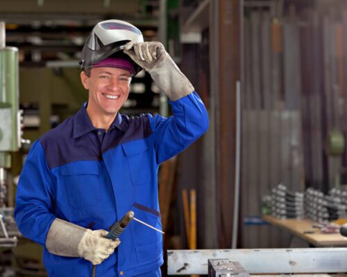 happy welder at work place